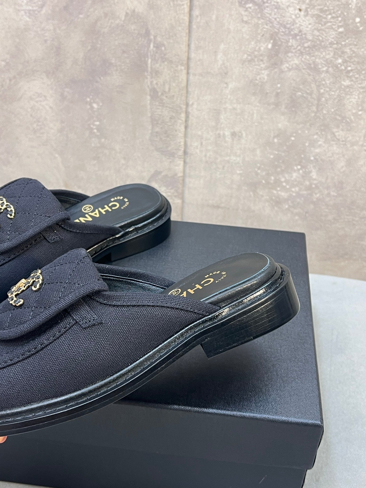CHANEL 26S MULE LOAFERS IN BLACK CANVAS WITH QUILTED FLAP & CHAIN CC LOGO