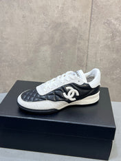 CHANEL 26S SNEAKERS IN BLACK AND WHITE QUILTED CALFSKIN CC LOGO