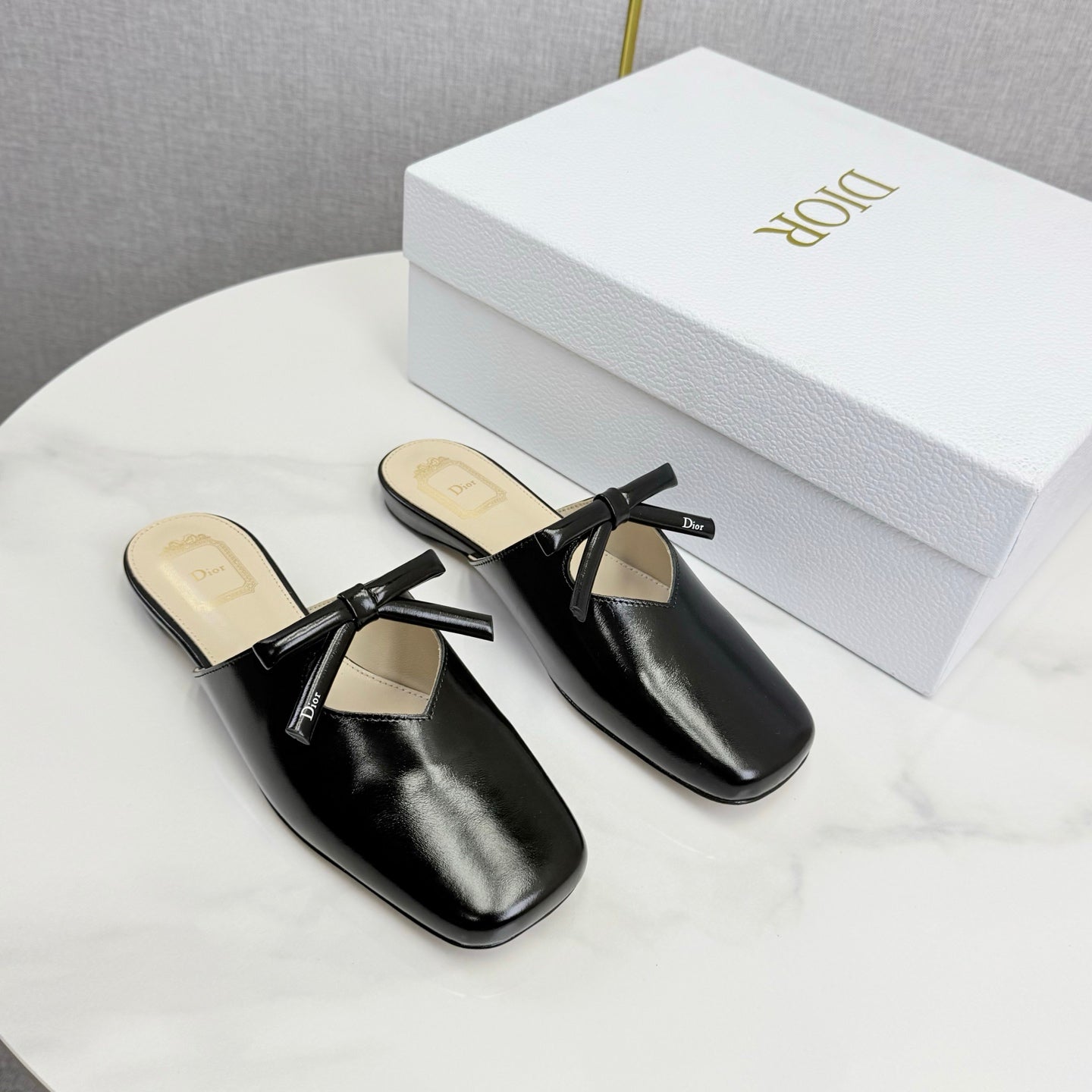 DIOR 26S PEARL-ACCENT BOW FLAT MULES IN BLACK GLOSSY CALFSKIN