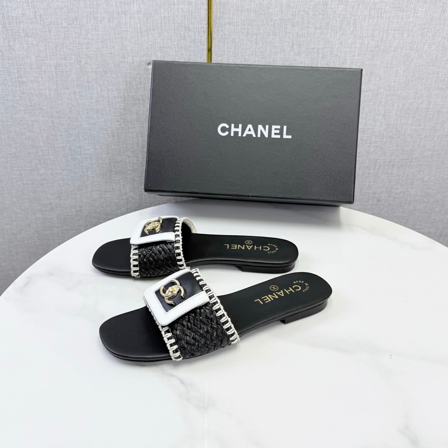 CHANEL 26S WOVEN STRAP SLIDES IN BLACK LAMBSKIN
