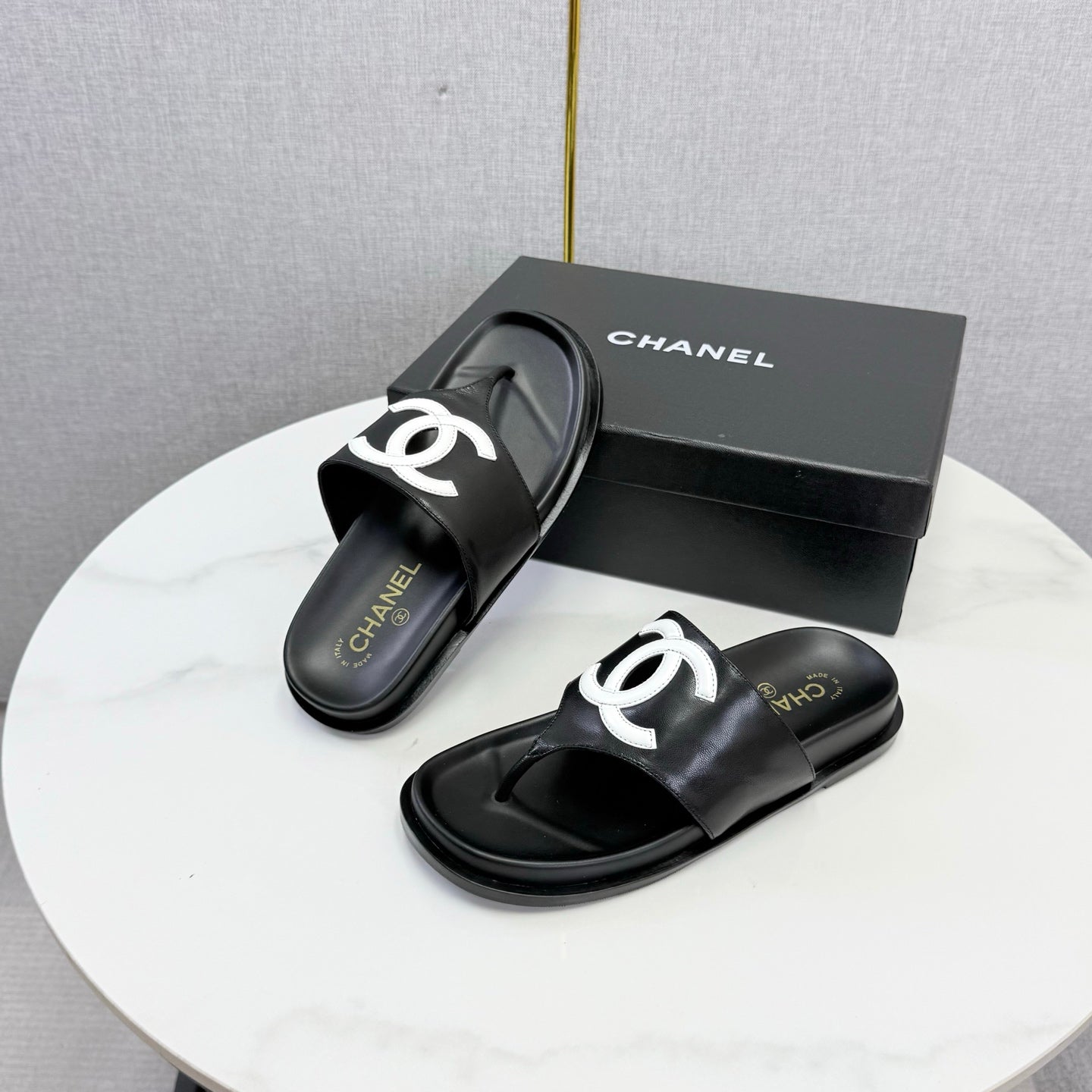 CHANEL 26S CC THONG SLIDES IN BLACK LAMBSKIN
