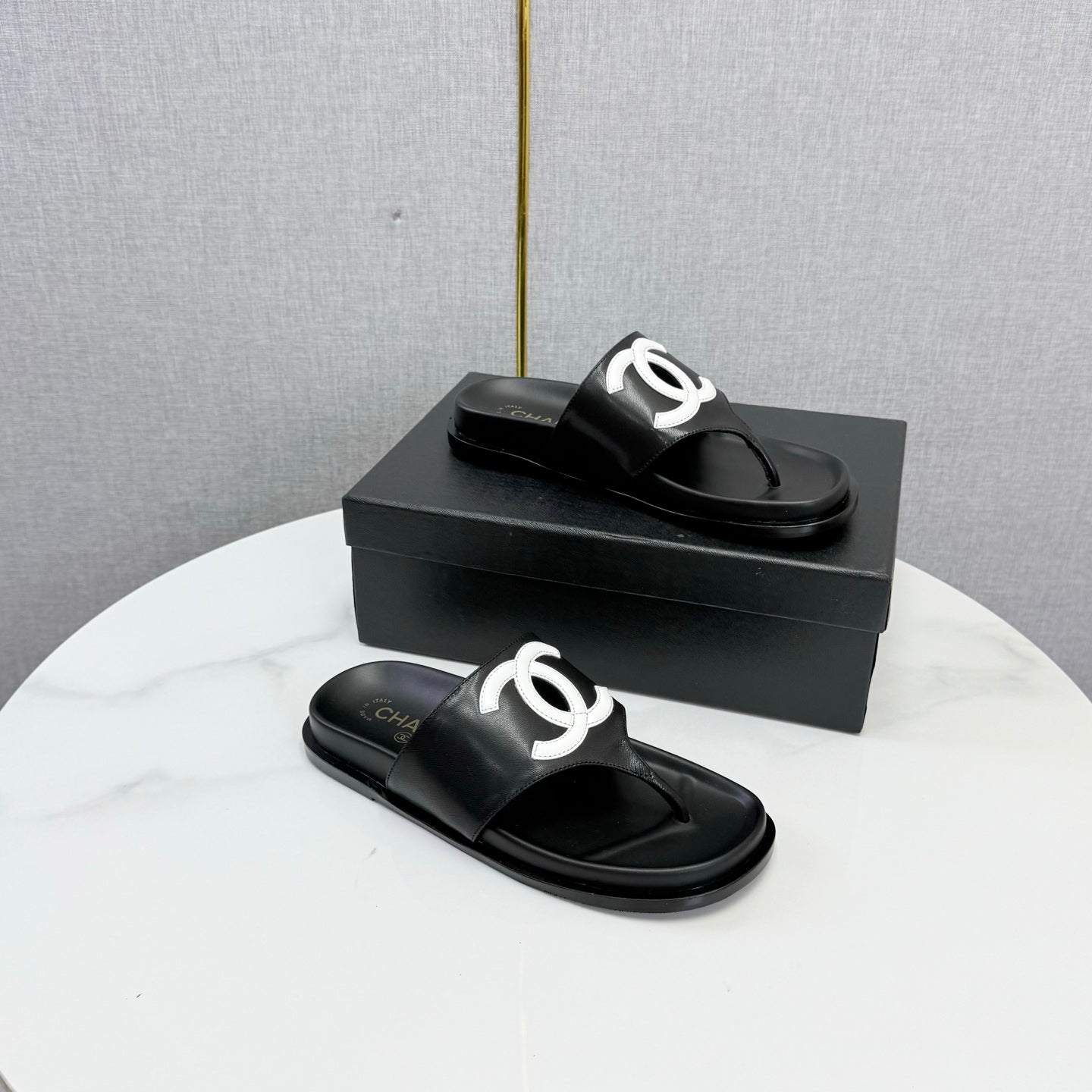 CHANEL 26S CC THONG SLIDES IN BLACK LAMBSKIN