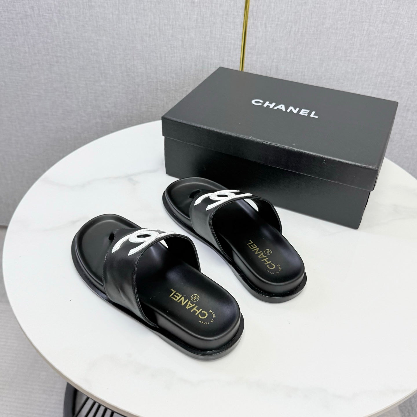 CHANEL 26S CC THONG SLIDES IN BLACK LAMBSKIN