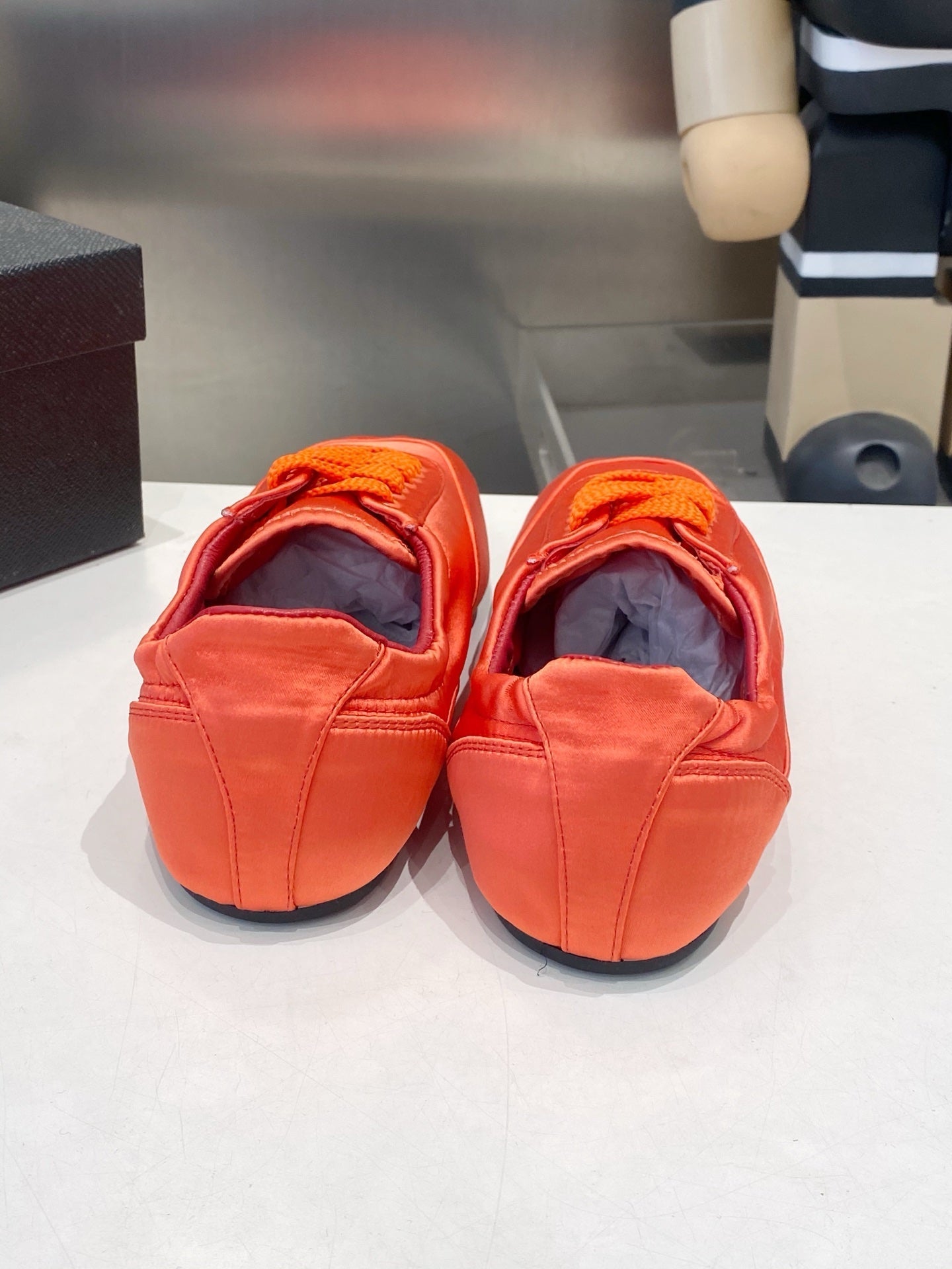 PRADA 26S SNEAKERS IN BURNT ORANGE SATIN