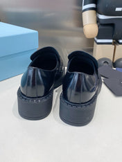 PRADA 26S LOAFERS IN BLACK CALFSKIN WITH LOGO SILVER HARDWARE