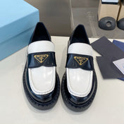 PRADA 26S LOAFERS IN BLACK AND WHITE CALFSKIN WITH LOGO