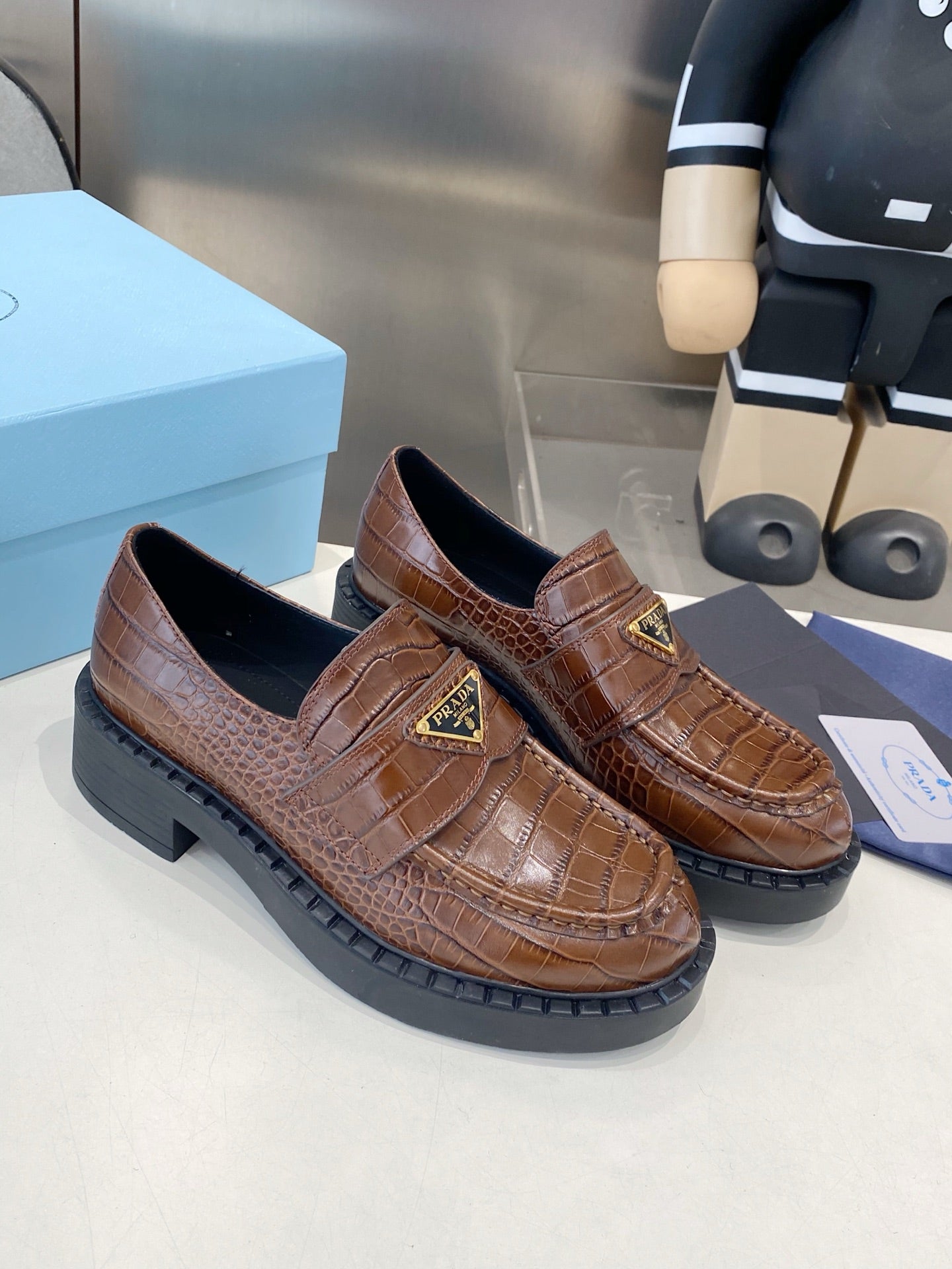 PRADA 26S LOAFERS IN DARK BROWN CROCODILE PRINT CALFSKIN