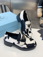 PRADA 26S LOAFERS IN WHITE AND BLACK COW PRINT PONY HAIR