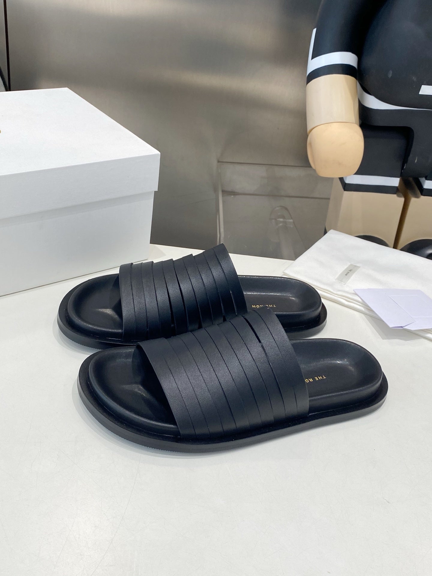 THE ROW 26S MULTI STRAP SLIDES IN BLACK CALFSKIN
