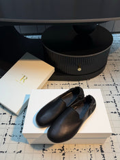 THE ROW 26S LOAFERS IN BLACK CALFSKIN