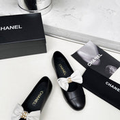 CHANEL 25S MARY JANES IN BLACK CALFSKIN WITH WHITE BOW GOLD HARDWARE
