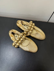 ALAIA SPHERE BALLET FLATS IN GOLDEN LAMBSKIN
