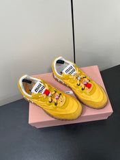 TYRE SNEAKERS IN YELLOW TECHNICAL FABRIC AND SUEDE WITH STICKER