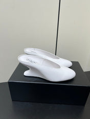 ALAIA WEDGE MULES 25S IN CREAM WHITE LAMBSKIN