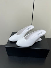 ALAIA WEDGE MULES 25S IN CREAM WHITE LAMBSKIN