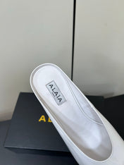 ALAIA WEDGE MULES 25S IN CREAM WHITE LAMBSKIN