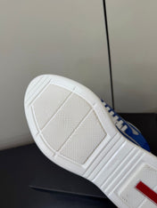 PRADA 26S SNEAKERS IN DARK BLUE PATENT CALFSKIN AND WHITE MESH