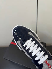 PRADA 26S SNEAKERS IN NAVY BLUE PATENT CALFSKIN AND WHITE MESH