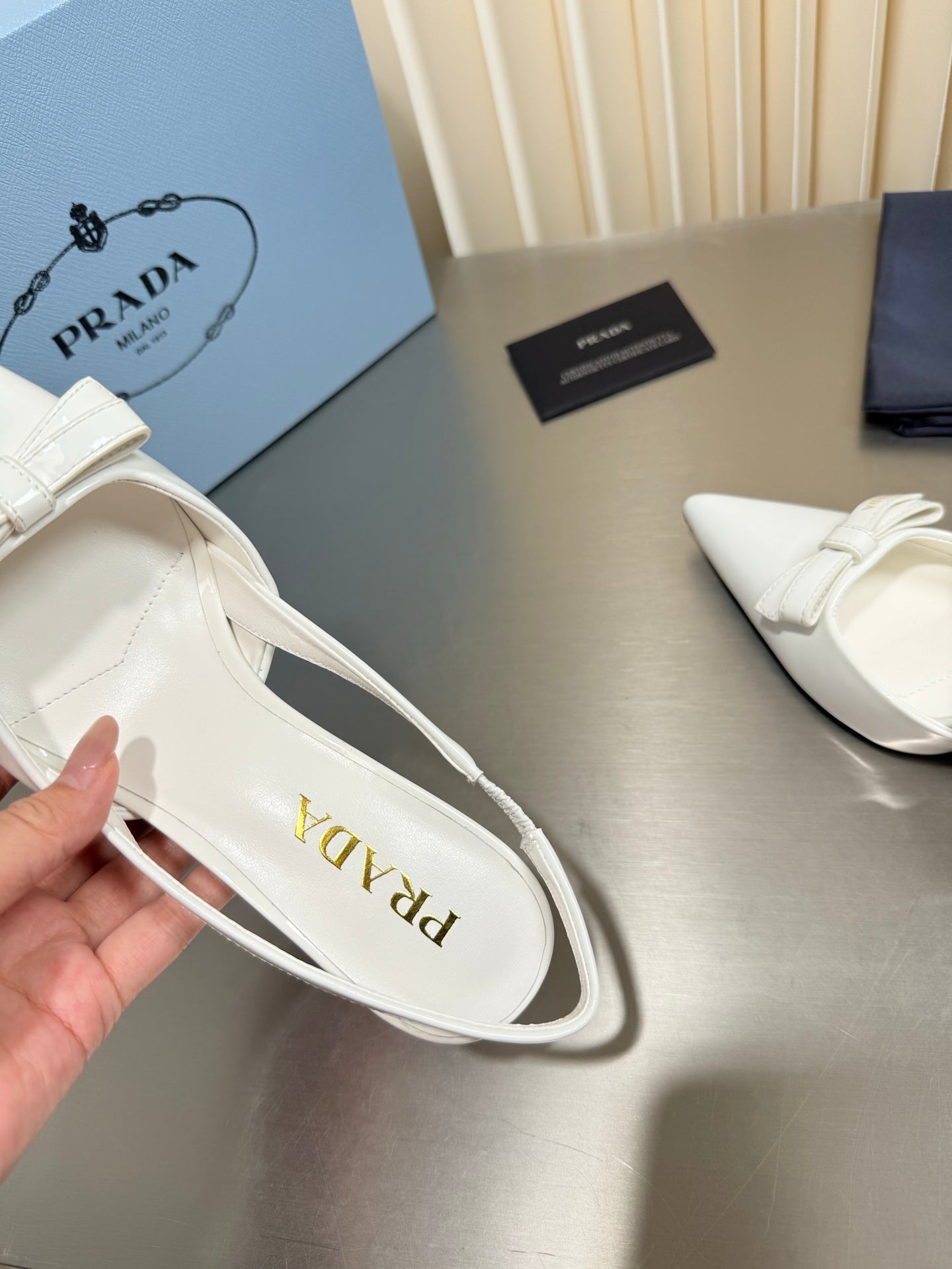 PRADA 26S POINTED-TOE SLINGBACK PUMPS IN WHITE PATENT CALFSKIN WITH BOW