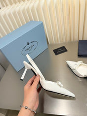PRADA 26S POINTED-TOE SLINGBACK PUMPS IN WHITE PATENT CALFSKIN WITH BOW