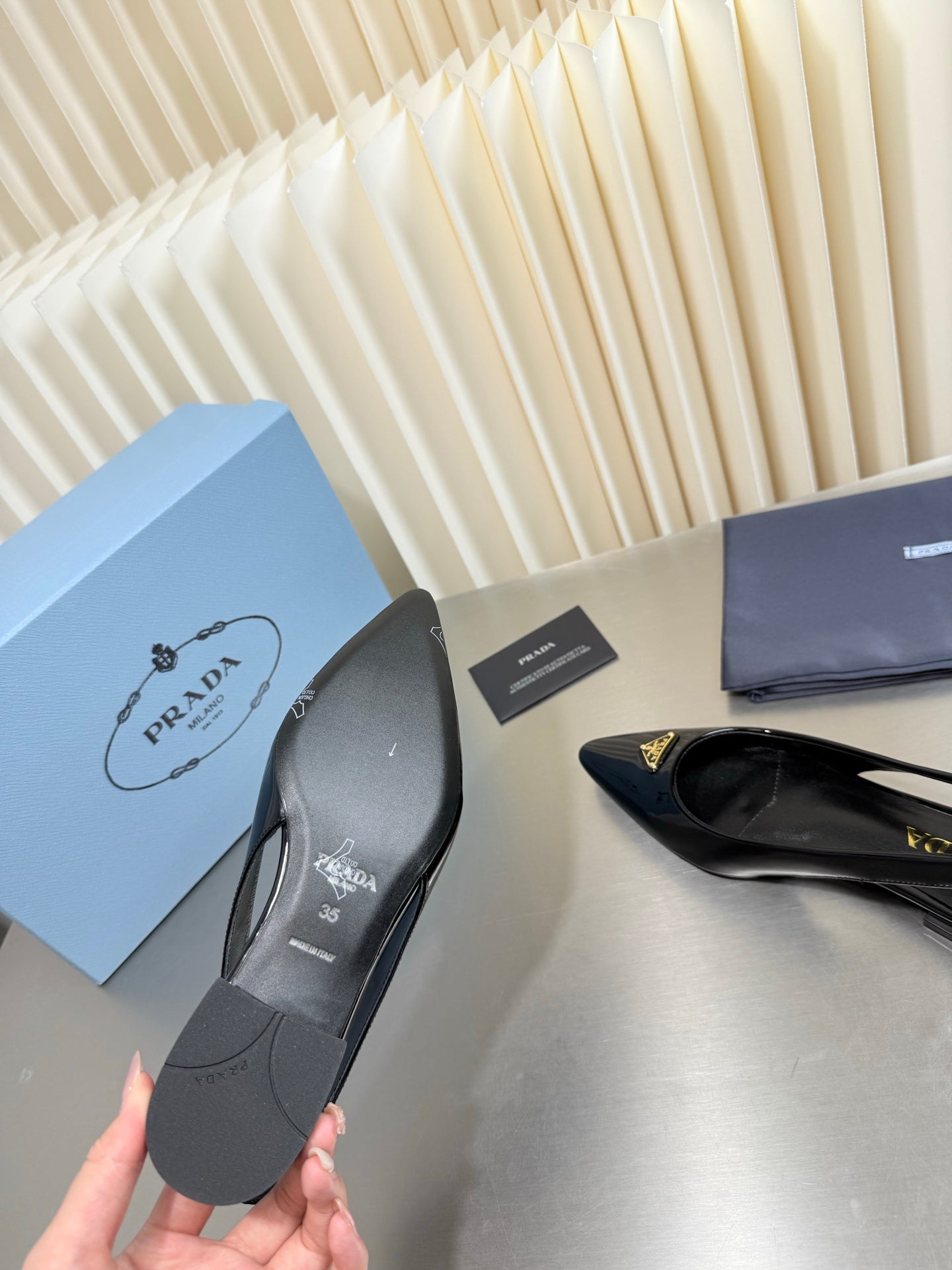 PRADA 26S SLINGBACK FLATS IN BLACK PATENT CALFSKIN WITH GOLD HARDWARE