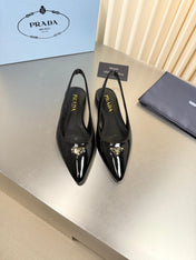 PRADA 26S SLINGBACK FLATS IN BLACK PATENT CALFSKIN WITH GOLD HARDWARE