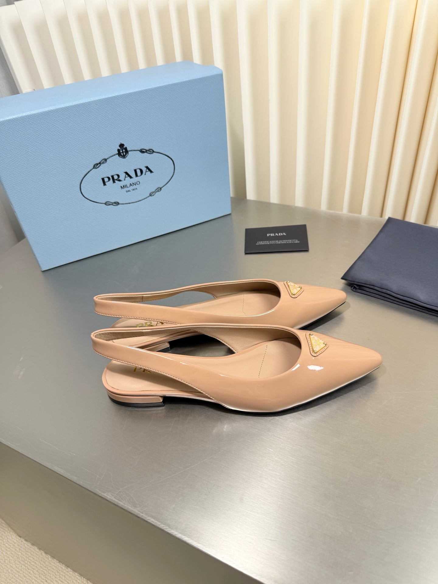 PRADA 26S SLINGBACK FLATS IN BEIGE PATENT CALFSKIN WITH GOLD HARDWARE