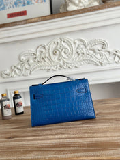 HM 26S KELLY MINI 22MM IN DARK BLUE CROC EMBOSSED CALFSKIN SILVER KELLY BUCKLE
