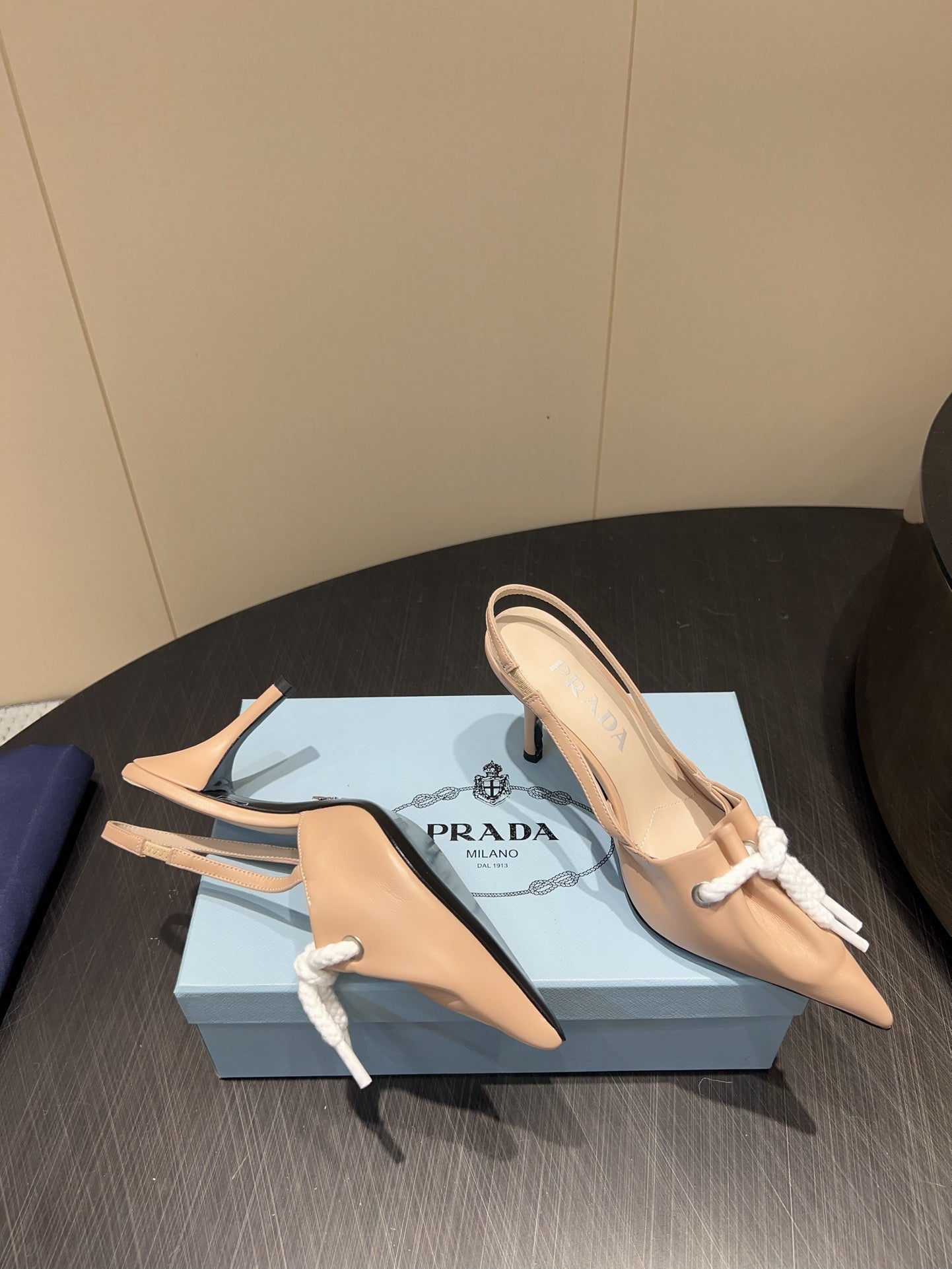 PRADA 25S POINTED TOE SLINGBACK 85MM IN BEIGE LAMBSKIN WITH TIE UP DESIGN