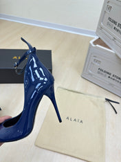 DECOLLETE PUMPS IN NAVY BLUE PATENT CALFSKIN