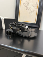 FLAT SANDALS IN BLACK CALFSKIN WITH BOW