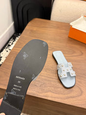 HM 26S ORAN STUDDED SANDALS IN DUSTY BLUE CALFSKIN