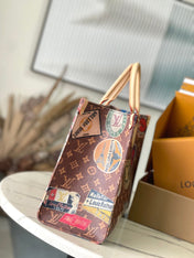 ONTHEGO VOYAGE 35 IN BROWN MONOGRAM CANVAS WITH VINTAGE HOTEL LABELS