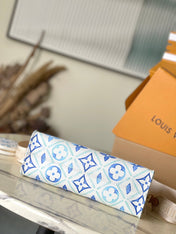 ONTHEGO EAST WEST 25 IN LAGOON BLUE MONOGRAM TILES CANVAS
