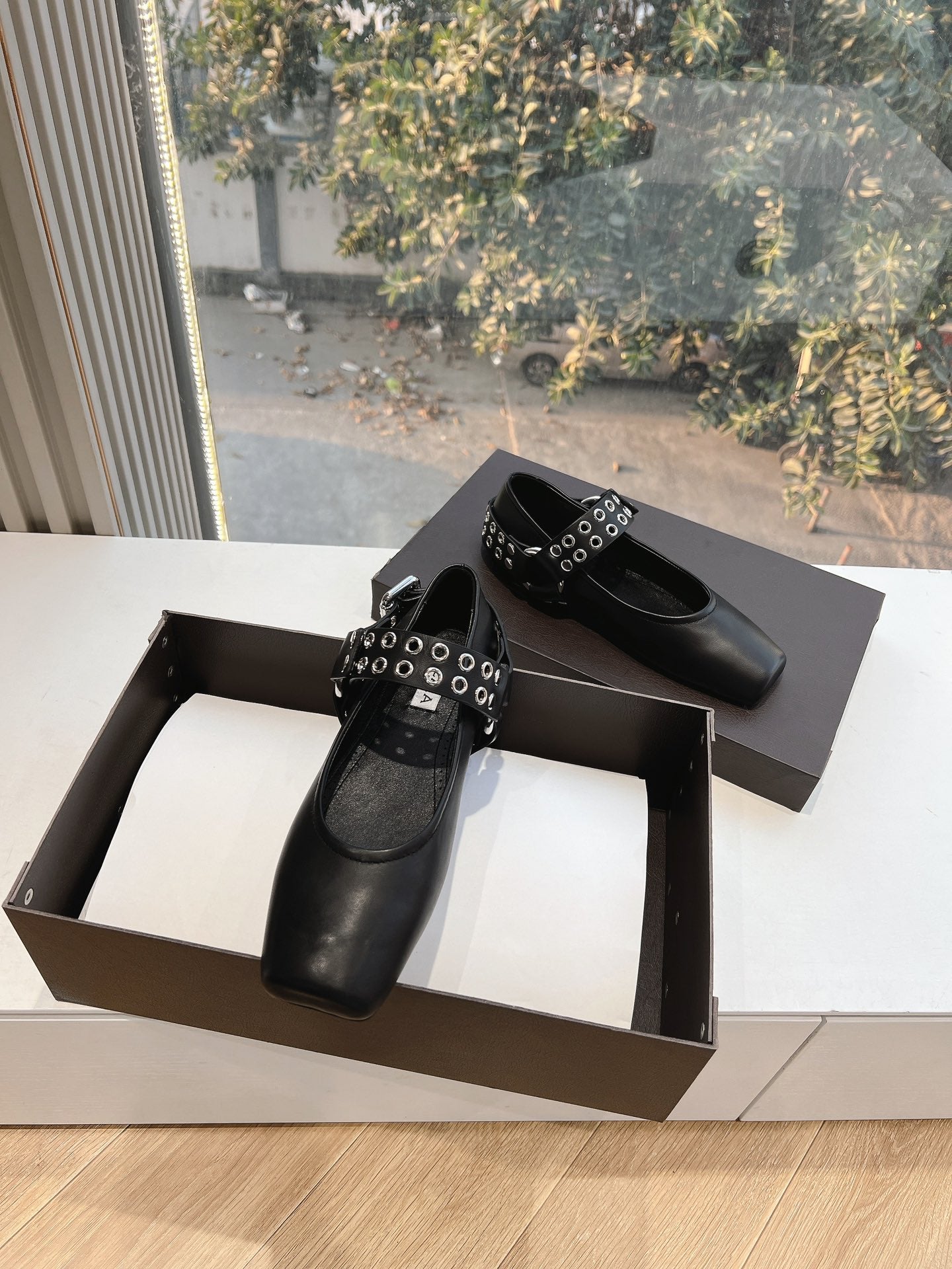 ALAIA 26S FLATS IN BLACK CALFSKIN WITH SILVER STUD STRAP