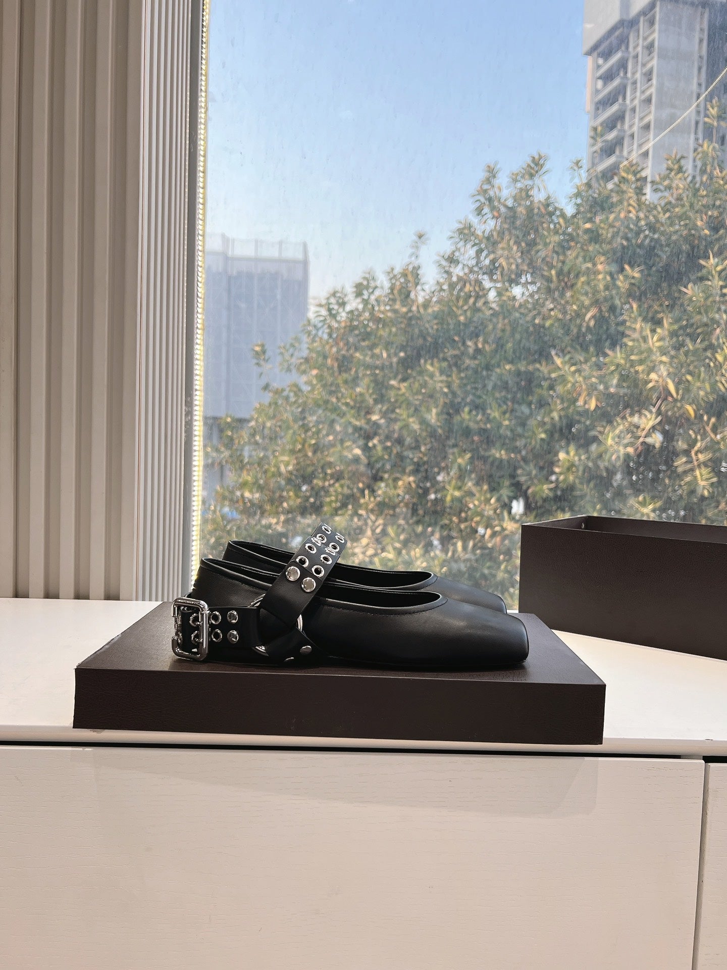 ALAIA 26S FLATS IN BLACK CALFSKIN WITH SILVER STUD STRAP