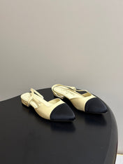 CHANEL 26S POINTED TOE SLINGBACKS IN CREAM LAMBSKIN AND BLACK FABRIC