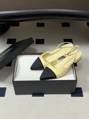 CHANEL 26S POINTED TOE SLINGBACKS IN CREAM LAMBSKIN AND BLACK FABRIC