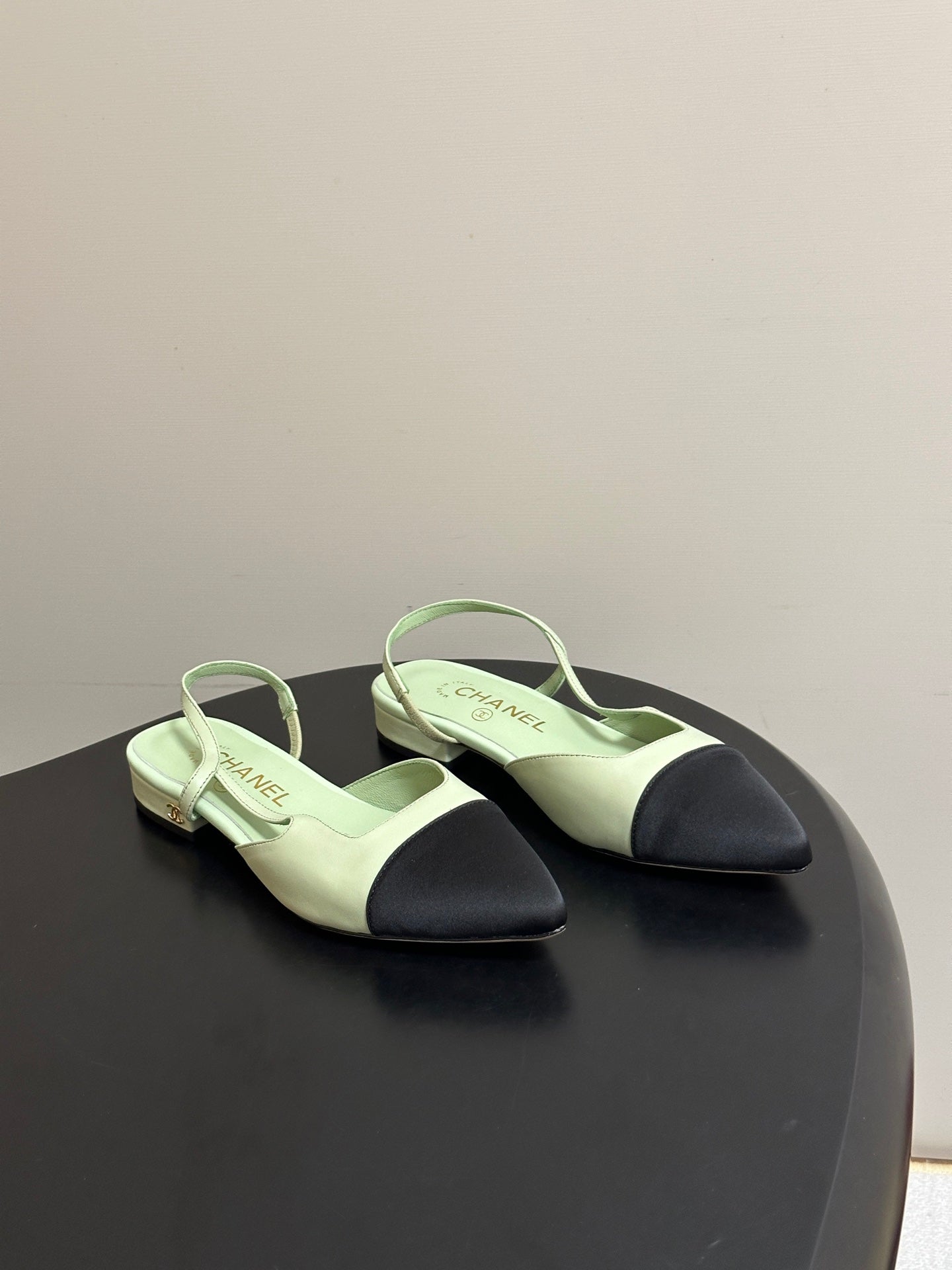CHANEL 26S POINTED TOE SLINGBACKS IN PASTEL GREEN LAMBSKIN AND BLACK FABRIC