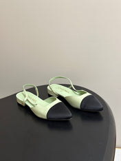 CHANEL 26S POINTED TOE SLINGBACKS IN PASTEL GREEN LAMBSKIN AND BLACK FABRIC