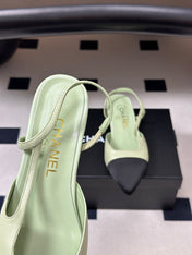 CHANEL 26S POINTED TOE SLINGBACKS IN PASTEL GREEN LAMBSKIN AND BLACK FABRIC