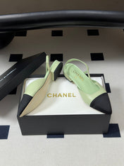 CHANEL 26S POINTED TOE SLINGBACKS IN PASTEL GREEN LAMBSKIN AND BLACK FABRIC