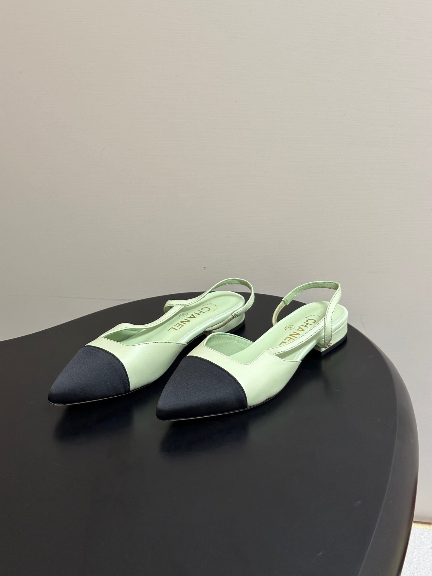 CHANEL 26S POINTED TOE SLINGBACKS IN PASTEL GREEN LAMBSKIN AND BLACK FABRIC