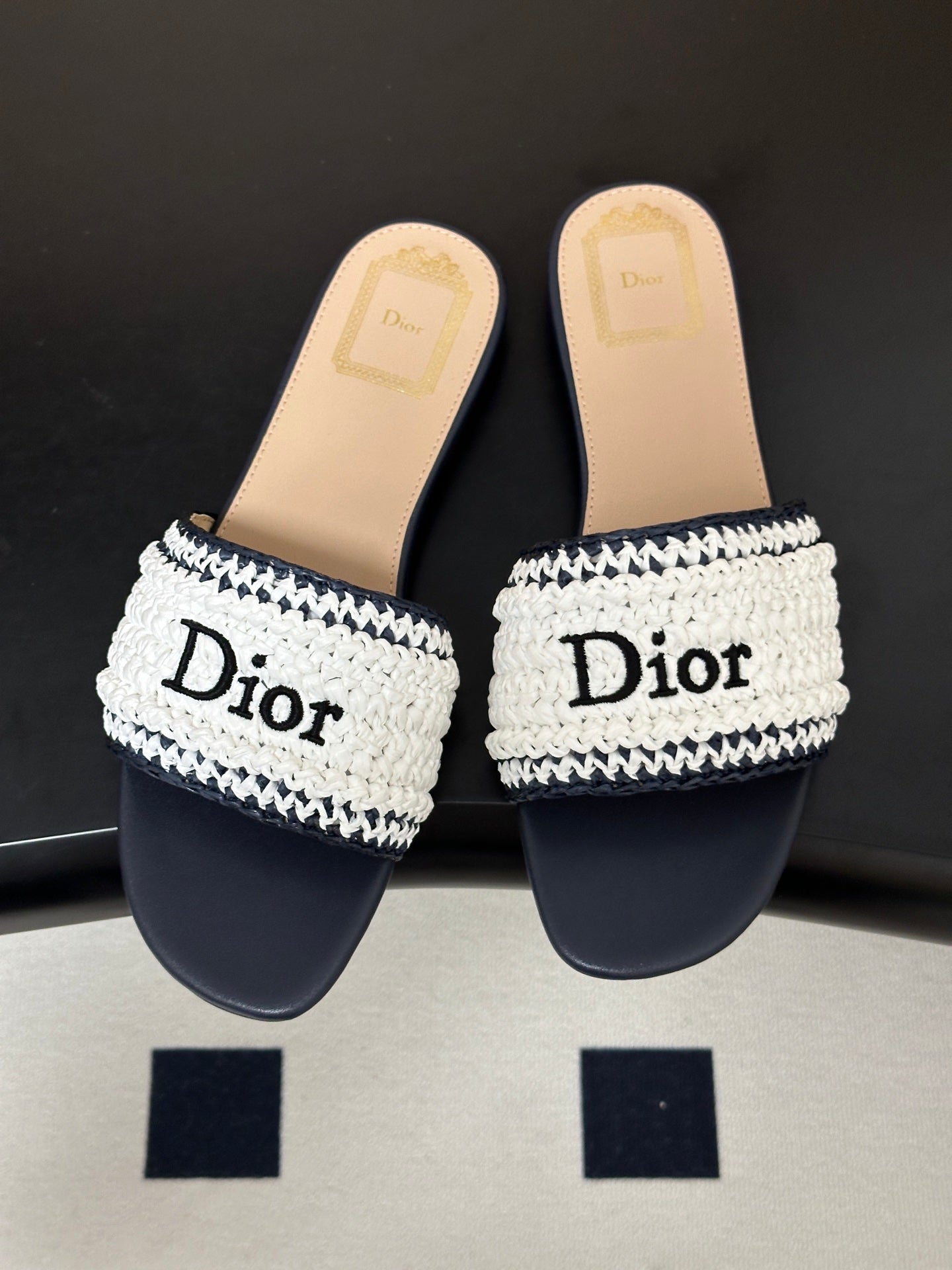 DIOR 26S FLAT SLIDE SANDALS IN WHITE AND NAVY BLUE RAFFIA