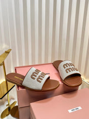 SLIDES SANDALS IN BROWN STRAW WOVEN