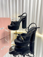 MIUMIU 26S PLATFORM ANKLE STRAP SANDALS 120MM IN BLACK SUEDE WITH BOW