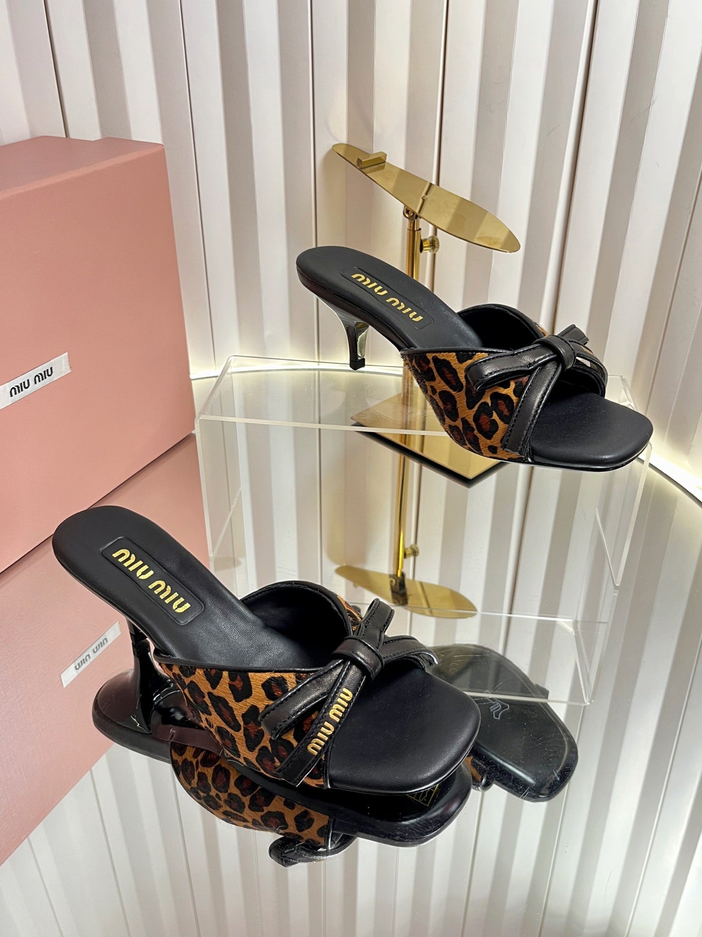 MIUMIU 26S MULE SANDALS 55MM IN LEOPARD PRINT CALF HAIR WITH BOW