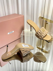 MIUMIU 26S HIGH-HEEL MULE SANDALS 85MM IN BEIGE CALFSKIN GOLD HARDWARE