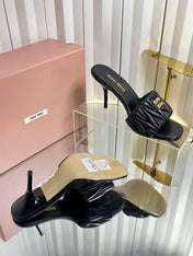MIUMIU 26S HIGH-HEEL MULE SANDALS 85MM IN BLACK CALFSKIN GOLD HARDWARE