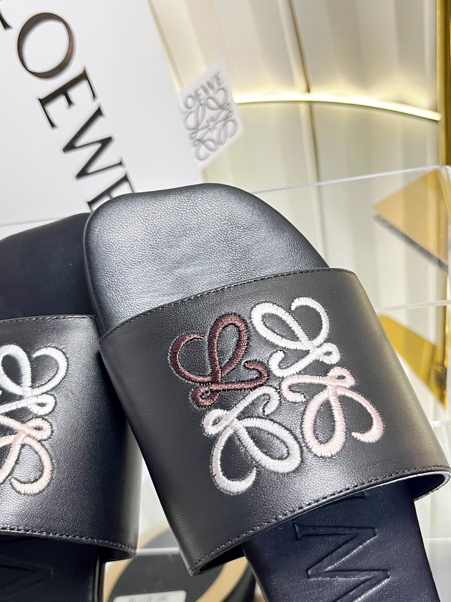 LOEWE 26S LOGO-EMBROIDERED SANDALS IN BLACK CALFSKIN